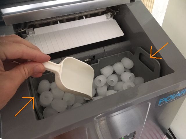 1. Lift the ice basket from the machine. Place it on a tea towel to save dripping everywhere.
